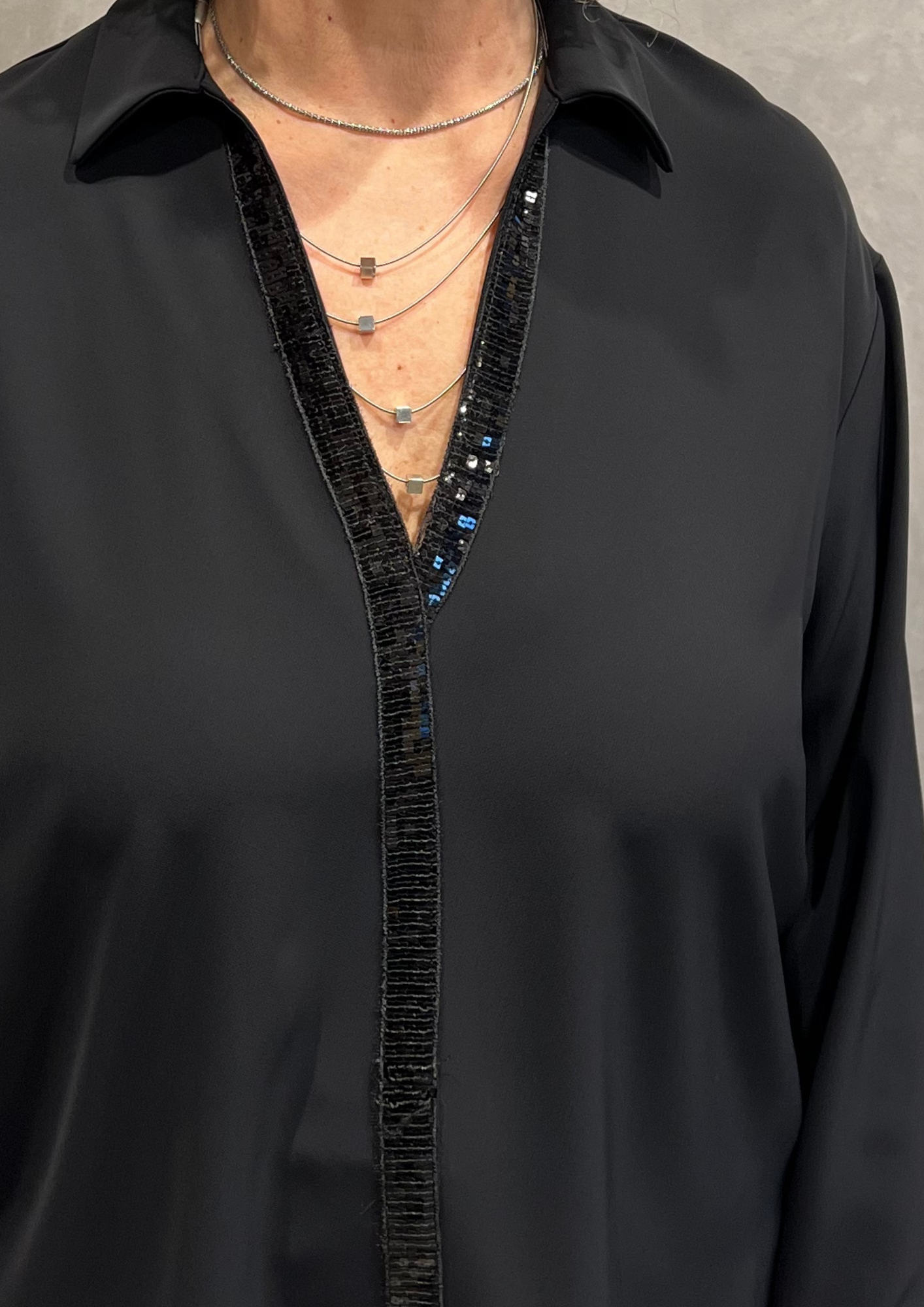 Blusa over svasata con dettaglio paillettes